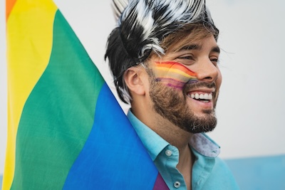 Happy homosexual man having fun celebrating gay pride festival day